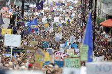 People hold banners during a demonstration against Britain's decision to leave the European Union, in central London, Britain, July 2, 2016. PHOTO BY REUTERS/Paul Hackett