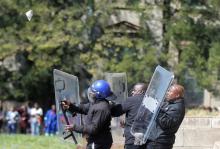Students throw stones during clashes with security at Johannesburg's University of the Witwatersrand. Demonstrations this year and in 2015 over the cost of university education have highlighted frustration at the inequalities that persist more than two decades after the 1994 end of white minority rule. PHOTO BY REUTERS/Siphiwe Sibeko