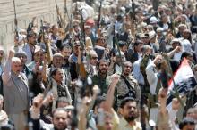 Armed people demonstrate outside the United Nations offices against Saudi-led air strikes on funeral hall in Sanaa, the capital of Yemen, October 9, 2016. PHOTO BY REUTERS/Khaled Abdullah
