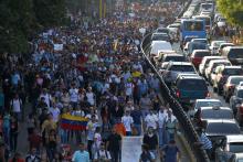 Demonstrators march during a protest against President Nicolas Maduro's government in Caracas