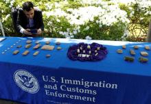 A man photographs artifacts on display, as U.S. Immigration and Customs Enforcement (ICE) hosts an event to return several thousand ancient artifacts to the Republic of Iraq, at the Iraqi ambassador's residence in Washington, DC, U.S., May 2, 2018. PHOTO BY REUTERS/Kevin Lamarque