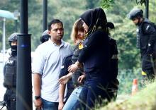 Doan Thi Huong leaves a Sepang court after she was charged with the murder of North Korea Kim Jong Nam, in Malaysia. PHOTO BY REUTERS/Alexandra Radu