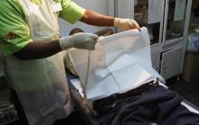 A doctor (L) performs circumcision to an unidentified politician in Harare. PHOTO BY REUTERS/Philimon Bulawayo