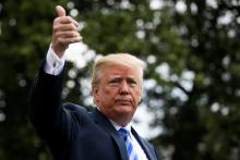 U.S. President Donald Trump gestures before boarding Marine One to travel to Texas from the South Lawn of the White House in Washington, U.S., May 4, 2018. PHOTO BY REUTERS/Matej Leskovsek