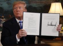 U.S. President Donald Trump displays a presidential memorandum after announcing his intent to withdraw from the JCPOA Iran nuclear agreement in the Diplomatic Room at the White House in Washington, U.S., May 8, 2018. PHOTO BY REUTERS/Jonathan Ernst