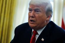 U.S. President Donald Trump delivers remarks after signing sweeping tax overhaul legislation into law in the Oval Office at the White House in Washington, U.S., December 22, 2017. PHOTO BY REUTERS/Jonathan Ernst