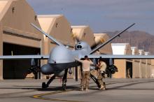 U.S. airmen prepare a U.S. Air Force MQ-9 Reaper drone as it leaves on a mission at Kandahar Air Field, Afghanistan March 9, 2016. PHOTO BY REUTERS/Josh Smith
