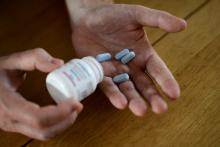 Will Nutland, who supports a drug-buying network and takes generic drugs himself to prevent HIV infection, shows off some of his generic drugs during an interview with Reuters at his home in central London, Britain, November 3, 2016. PHOTO BY REUTERS/Dylan Martinez