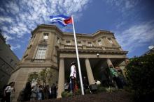 A guard stands in front of the new Cuban embassy in Washington after officials raised the national flag in a ceremony, July 20, 2015. PHOTO BY REUTERS/Carlos Barria