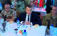 French President Emmanuel Macron, seen in this still image taken from video, sits with French military forces during a visit with troops who participate in the Operation Barkhane in Niamey, Niger, late December 22, 2017. PHOTO BY REUTERS