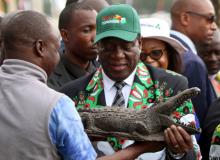 Zimbabwe’s President Emmerson Mnangagwa receives a gift after officially opening the Extraordinary Congress of the ruling party ZANU PF in Harare, Zimbabwe, December 15, 2017. PHOTO BY REUTERS/Philimon Bulawayo