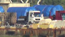 A still image taken from a video footage shows blue tarpaulins covering equipment at the port of Feodosia, Crimea, July 11, 2017. PHOTO BY REUTERS/Staff