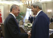 U.S. Secretary of State John Kerry (R) and Turkey's President Tayyip Erdogan talk at the beginning of a meeting in Ankara