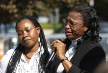 Plaintiff Esther Kiobel (R) speaks during a protest against Royal Dutch Shell Petroleum in front of the U.S. Supreme Court in Washington, October 1, 2012. PHOTO BY REUTERS/Gary Cameron