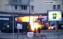 An explosion lighting the front of a kosher supermarket as French police special forces launch their assault, where several people were taken hostage near the Porte de Vincennes in eastern Paris, January 9, 2015. PHOTO BY REUTERS/BFMTV via Reuters TV