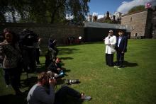 Fatima Boudchar, wife of Libyan politician Hakim Belhadj, stands with their son Abderrahim, as she holds a letter of apology from Prime Minister Theresa May outside the Houses of Parliament in Westminster, London, Britain, May 10, 2018. PHOTO BY REUTERS/Hannah McKay
