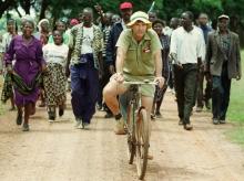 Zimbabwean commercial famer Tommy Bayley rides an old bicycle to an abandoned house to use as temporary shelter ahead of war veterans and villagers who invaded his farm Danbury Park in Maze, April 8, 2000. PHOTO BY REUTERS/Howard Burditt