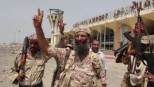 Southern Resistance fighters flash the victory sign at the international airport of Yemen's southern port city of Aden, July 14, 2015. PHOTO BY REUTERS/Stringer