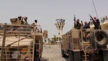 Southern Resistance fighters ride armoured personnel carriers at the international airport of Yemen's southern port city of Aden, July 14, 2015. PHOTO BY REUTERS/Stringer