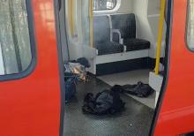 Personal belonglongs and a bucket with an item on fire inside it, are seen on the floor of an underground train carriage at Parsons Green station in West London, Britain September 15, 2017, in this image taken from social media. PHOTO BY REUTERS/SYLVAIN PENNEC