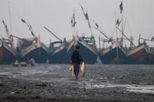 A Rohingya fisherman walks on the beach in Sittwe in the state of Rakhine, Myanmar, March 2, 2017. PHOTO BY REUTERS/Soe Zeya Tun