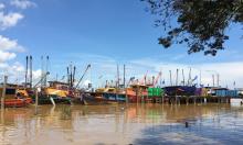 Malaysian fishing boats moored at the Bintulu fishing jetty to land their catch, May 5, 2016. PHOTO BY REUTERS/Joseph Sipalan