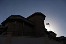 A Iranian flag flutters in the winds at the Iranian ambassador's residence in Sanaa, January 18, 2014. PHOTO BY REUTERS/Mohamed al-Sayaghi