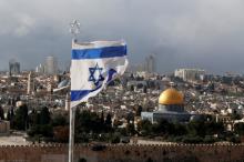 An Israeli flag is seen near the Dome of the Rock, located in Jerusalem's Old City on the compound known to Muslims as Noble Sanctuary and to Jews as Temple Mount, December 6, 2017. PHOTO BY REUTERS/Ammar Awad