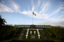 An Irish flag flies above a tribute to the 1981 H-Block hunger strikers, on a roadside near Crossmaglen, in Northern Ireland, June 28, 2016. PHOTO BY REUTERS/Clodagh Kilcoyne