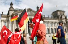 Demonstrators hold Turkish and German flags in front of the Reichstag, the seat of the lower house of parliament Bundestag in Berlin, Germany, June 1, 2016, as they protest against a disputed vote in Germany's parliament on Thursday, on a resolution that labels the killings of up to 1.5 million Armenians by Ottoman forces as genocide. PHOTO BY REUTERS/Hannibal Hanschke