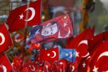 A flag with the picture of Turkey's President Tayyip Erdogan is seen during the Democracy and Martyrs Rally, organized by him and supported by ruling AK Party (AKP), to protest against last month's failed military coup attempt, in Istanbul, Turkey, August 7, 2016. PHOTO BY REUTERS/Osman Orsal