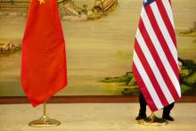 A U.S. flag is tweaked ahead of a news conference between U.S. Secretary of State John Kerry and Chinese Foreign Minister Wang Yi at the Ministry of Foreign Affairs in Beijing, Wednesday, Jan. 27, 2016. PHOTO BY REUTERS/Jacquelyn Martin