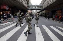 French soldiers patrol in the street near a department store in Paris as part of the highest level of "Vigipirate" security plan in Paris January 10, 2015. PHOTO BY REUTERS/Eric Gaillard