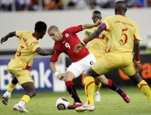 Mohamed Zidan of Egypt (C) is challenged by Damien Chrysostome (R) and Khaled Adenon of Benin during their African Nations Cup soccer match at Ombaka stadium in Benguela, January 20, 2010. PHOTO BY REUTERS/Amr Abdallah Dalsh