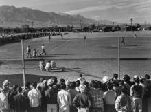 Spectators watch a baseball game at the Manzanar War Relocation Center in California, 1943. Ansel Adams/Library of Congress, Prints and Photographs Division, LC-A35-4-M-10. PHOTO BY REUTERS