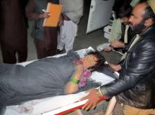 A wounded Afghan girl is rushed to a hospital in Helmand province, December 31, 2014. PHOTO BY REUTERS/ Abdul Malik