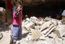 A Palestinian girl cries as she stands outside a cave that she lived in with her family after Israeli forces destroyed its entrance in Khirbet Tana, near the West Bank city of Nablus, April 7, 2016. PHOTO BY REUTERS/Abed Omar Qusini