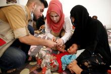 A displaced Iraqi girl is treated in a field hospital at the Hasansham U2 camp, where more than 300 people fell ill in a mass outbreak of food poisoning, in al-Khazer, east of Mosul, Iraq, June 13, 2017. PHOTO BY REUTERS/Alkis Konstantinidis
