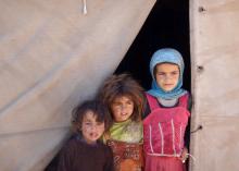 Girls stand at the entrance to their tent at a camp for internally displaced people in the northwestern city of Saada, Yemen, January 30, 2017. PHOTO BY REUTERS/Naif Rahma