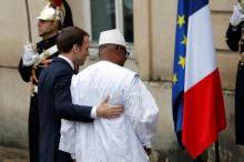 Mali's President Ibrahim Boubacar Keita is greeted by French President Emmanuel Macron as he hosts the leaders of the G5 Sahel countries near Paris, France, December 13, 2017. PHOTO BY REUTERS/Philippe Wojazer