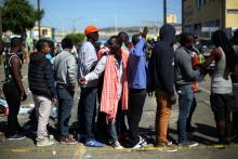 Haitian migrants line up outside Padre Chava shelter after leaving Brazil, where they sought refuge after Haiti's 2010 earthquake, but are now attempting to enter the U.S., in Tijuana, Mexico, October 3, 2016. PHOTO BY REUTERS/Edgard Garrido