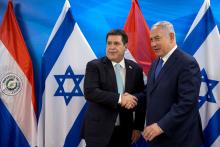 Paraguayan President Horacio Cartes shakes hands with Israeli Prime Minister Benjamin Netanyahu during a meeting at the Prime Minister's office in Jerusalem, following the dedication ceremony of the embassy of Paraguay in Jerusalem, May 21, 2018. PHOTO BY REUTERS/Sebastian Scheiner