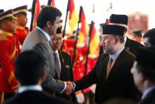 Qatar's Emir Sheikh Tamim bin Hamad al-Thani (L) shakes hand with Malaysia's King Muhammad V after a state welcome ceremony at the Parliament House in Kuala Lumpur, Malaysia, October 16, 2017. PHOTO BY REUTERS/Lai Seng Sin