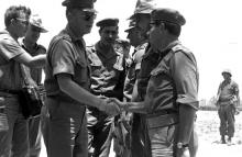 Israeli military Chief of Staff Yitzhak Rabin (C) shakes hands with soldiers stationed in the Negev Desert May 30, 1967 before the Middle East War, in this handout picture released by the Israeli Government Press Office (GPO). PHOTO BY REUTERS/GPO