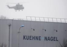 A helicopter with French intervention forces hovers above the scene of a hostage taking at an industrial zone in Dammartin-en-Goele, northeast of Paris, January 9, 2015. PHOTO BY REUTERS/Pascal Rossignol