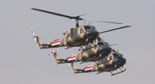 Iraqi Air Force helicopters participate in a flypast ceremony marking the Iraqi Army's 91st anniversary in Baghdad's fortified Green Zone