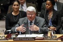 U.N. Head of the Department of Peacekeeping Operations Herve Ladsous (C) speaks to members of United Nations Security Council during a meeting on the Ebola crisis at the U.N. headquarters in New York