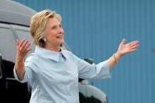 U.S. Democratic presidential nominee Hillary Clinton reacts to her newly unveiled campaign plane before boarding for the first time at the Westchester County Airport in White Plains, New York, U.S., September 5, 2016. PHOTO BY REUTERS/Brian Snyder