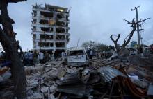 Somali government soldiers stand outside the ruins of the Jazeera hotel after an attack in Somalia's capital Mogadishu, July 26, 2015. PHOTO BY REUTERS/Feisal Omar