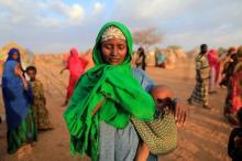 An internally displaced woman from drought hit area reacts after she complains about the lack of food at makeshift settlement area in Dollow, Somalia, April 4, 2017. PHOTO BY REUTERS/ Zohra Bensemra
